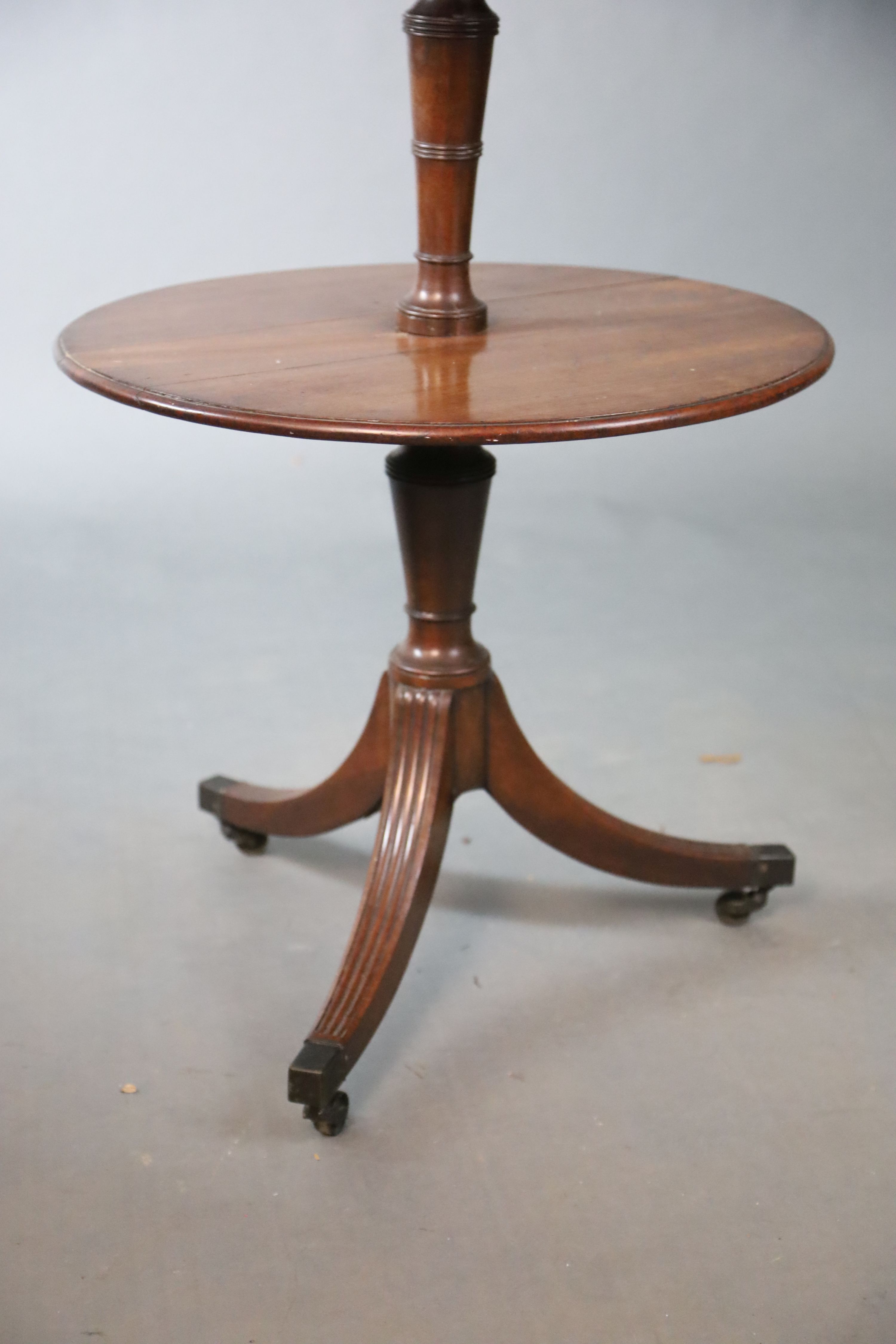 A Regency mahogany three tier dumb waiter, Diam. 58.5cm H.117cm